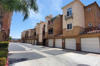 Entry to community with view of buildings and garages